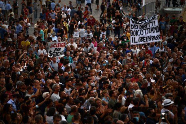 Protesters take part in a demonstration against the introduction of a mandatory 'green pass', in Piazza del Popolo in Rome, on July 28, 2021. (Filippo Monteforte/AFP via Getty Images)