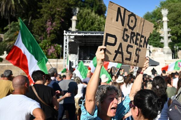 Members of the 'No Vax' take part in a demonstration against the introduction of a mandatory "green pass" in the aim to limit the spread of the Covid-19, at the Piazza del Popolo in central Rome, on Aug. 7, 2021. (Alberto Pizzoli/AFP via Getty Images)