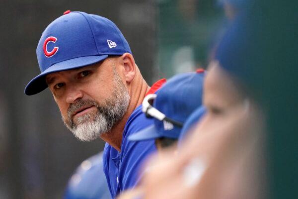 Chicago Cubs manager David Ross watches from the dugout during the eighth inning of a baseball game against the Milwaukee Brewers in Chicago, on Aug. 12, 2021. (Nam Y. Huh/AP Photo, File)