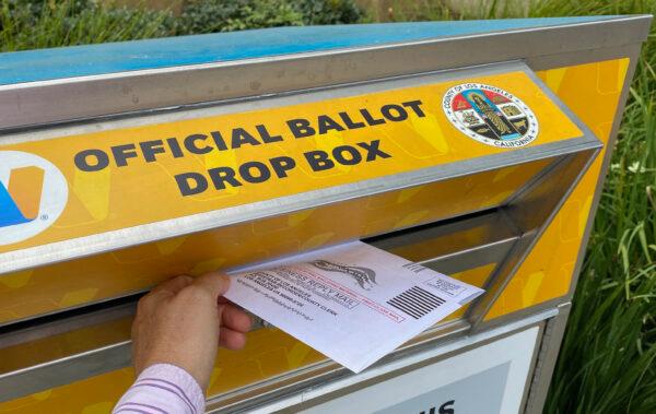 A person drops a ballot in a ballot drop box in Los Angeles on Aug. 31, 2021. (Chris Delmas/AFP via Getty Images)