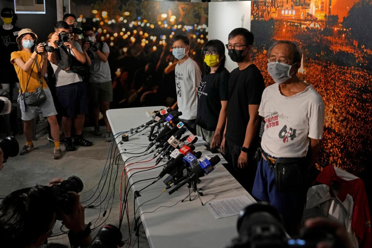 Chow Han Tung, vice chairwoman of the Hong Kong Alliance in Support of Patriotic Democratic Movements of China, second left, and other group members attend a news conference in Hong Kong, on Sept. 5, 2021. (Kin Cheung/AP Photo)