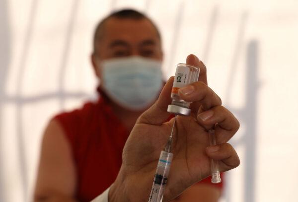 A health worker prepares a Sinovac vaccine against COVID-19 in Sao Paulo, Brazil, on June 18, 2021. (Rodrigo Paiva/Getty Images)