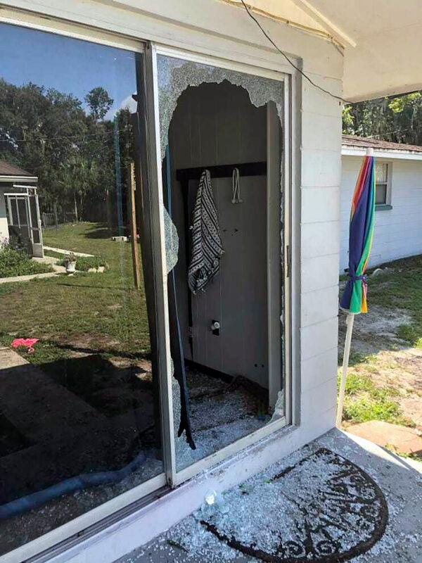 The back of the residence where a Polk sheriff's lieutenant entered the house and exchanged fire with a shooting suspect in a neighborhood in Lakeland, Fla., on Sept. 5, 2021. (Polk County Sheriff's Office via AP)