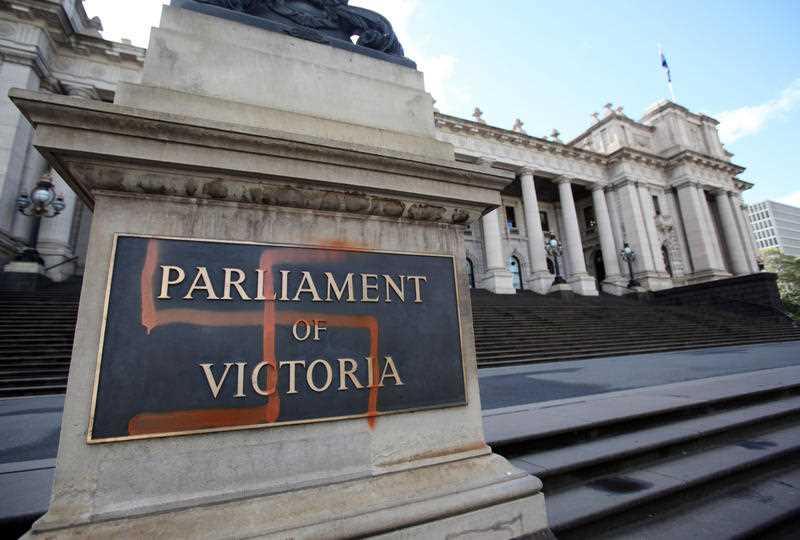 A Nazi swastika is seen graffitied on the front of the Victorian State Parliament, Oct. 1, 2012 (AAP Image/David Crosling)