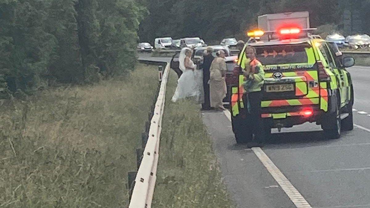 Lydia Evans-Hughes, 29, was given a lift to the church by kindhearted officers after the vintage car she was traveling in broke down at the side of the A55 near Chester. (SWNS)