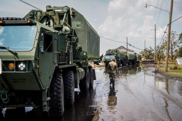 A convoy of Army vehicles bring aid into Jefferson Parish, La., on Sept. 4, 2021. (Jackson Elliott/The Epoch Times)