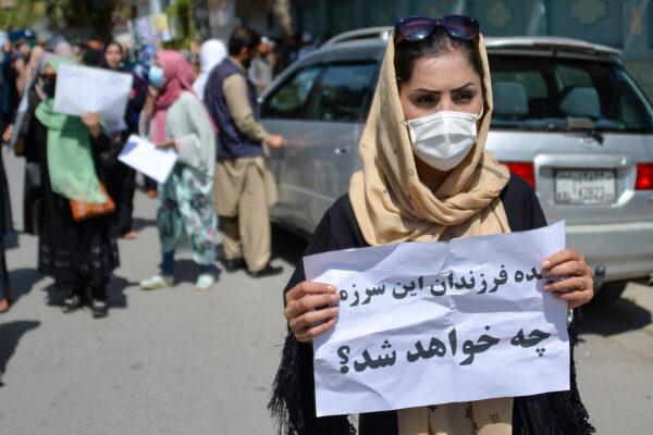 An Afghan woman displays a placard during an anti-Pakistan demonstration near the Pakistan embassy in Kabul on Sept. 7, 2021. (Hoshang Hashimi/AFP via Getty Images)