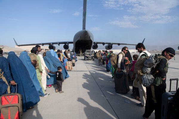 Passengers board a U.S. Air Force C-17 at Hamid Karzai International Airport in Kabul, Afghanistan, on Aug. 24, 2021. (Master Sgt. Donald R. Allen/U.S. Air Forces Europe-Africa via Getty Images)