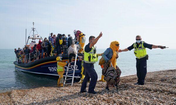An RNLI boat with people rescued during an attempted Channel cross from France at the shore near Dover, England, on Sept. 6, 2021. (Gareth Fuller/PA)
