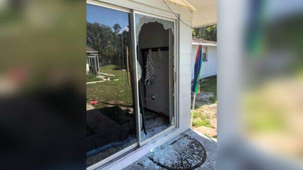 This image shows the back of the residence where a Polk sheriff's lieutenant entered the house and exchanged fire with a shooting suspect in a neighborhood in Lakeland, Fla., on Sept. 5, 2021. (Polk County Sheriff's Office via AP)