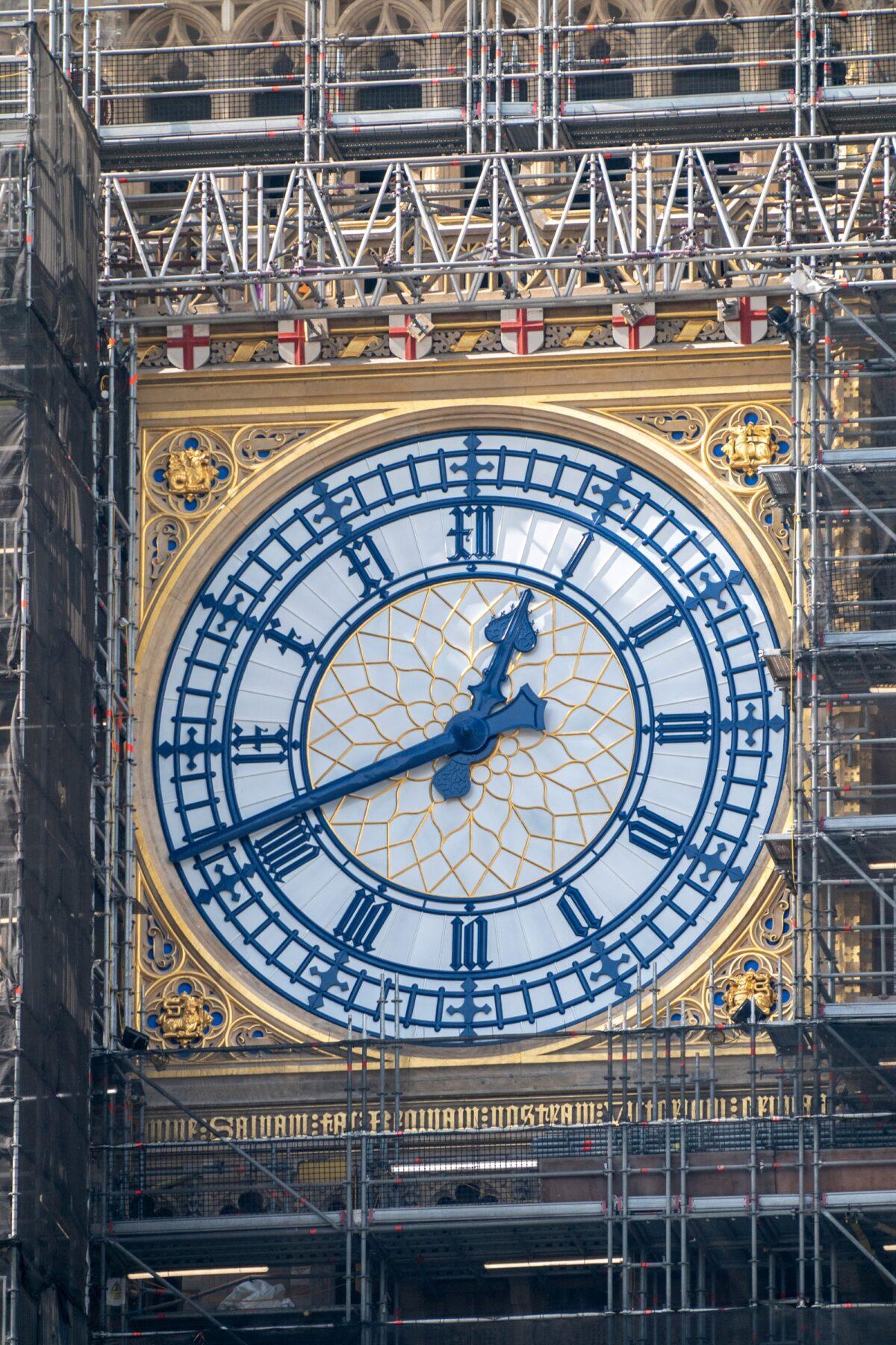 The St. George’s cross shields above the Big Ben clock face have been painted red and white, in central London on Sept. 6, 2021. (Stefan Rousseau/PA)