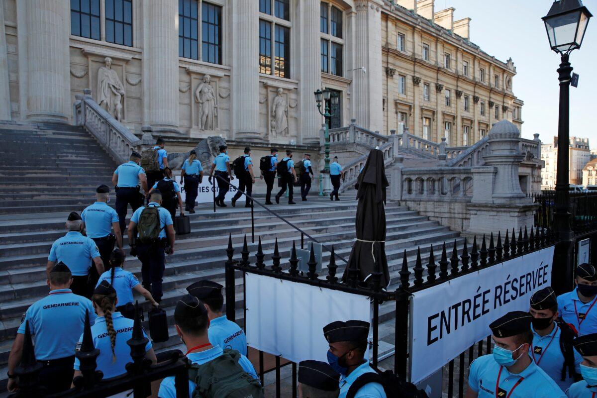 French Gendarmes enter the Paris courthouse on the Ile de la Cite before the start of the trial of the Paris' November 2015 attacks, in Paris, France, on Sept. 8, 2021. (Gonzalo Fuentes/Reuters)