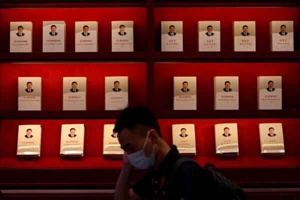 A patron walks past a display of books about Chinese leader Xi Jinping, in the Museum of the Communist Party of China in Beijing, on June 25, 2021, (Noel Celis/AFP via Getty Images)