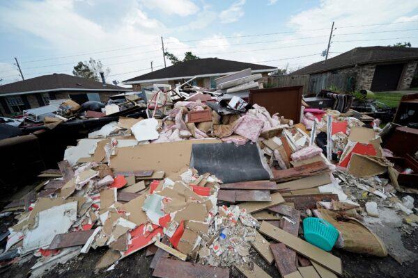 Debris piles up at curbside as residents gut their flooded homes in the aftermath of Hurricane Ida in LaPlace, La., on Sept. 7, 2021. (Gerald Herbert/AP Photo)