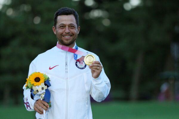 Xander Schauffele, of the United States, holds his gold medal in the men's golf at the 2020 Summer Olympics, in Kawagoe, Japan, on Aug. 1, 2021. (Andy Wong/AP)