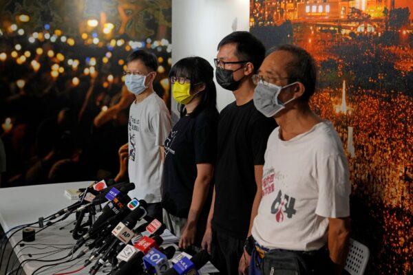 Chow Hang-tung (2nd L), vice chairwoman of the Hong Kong Alliance in Support of Patriotic Democratic Movements of China, and other group members attend a news conference in Hong Kong on Sept. 5, 2021. (Kin Cheung/AP Photo)