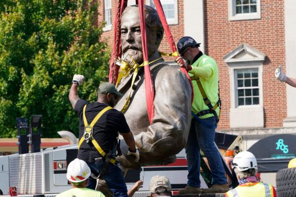 Crews remove the torso of Confederate General Robert E. Lee, one of the country's largest remaining monuments to the Confederacy, on Monument Avenue in Richmond, Va., on Sept. 8, 2021. (Steve Helber/AP Photo)