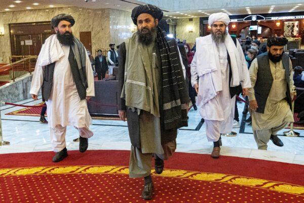 Mullah Abdul Ghani Baradar, the Taliban's deputy leader and negotiator, and other delegation members attend the Afghan peace conference in Moscow, on March 18, 2021. (Alexander Zemlianichenko/Pool via Reuters)