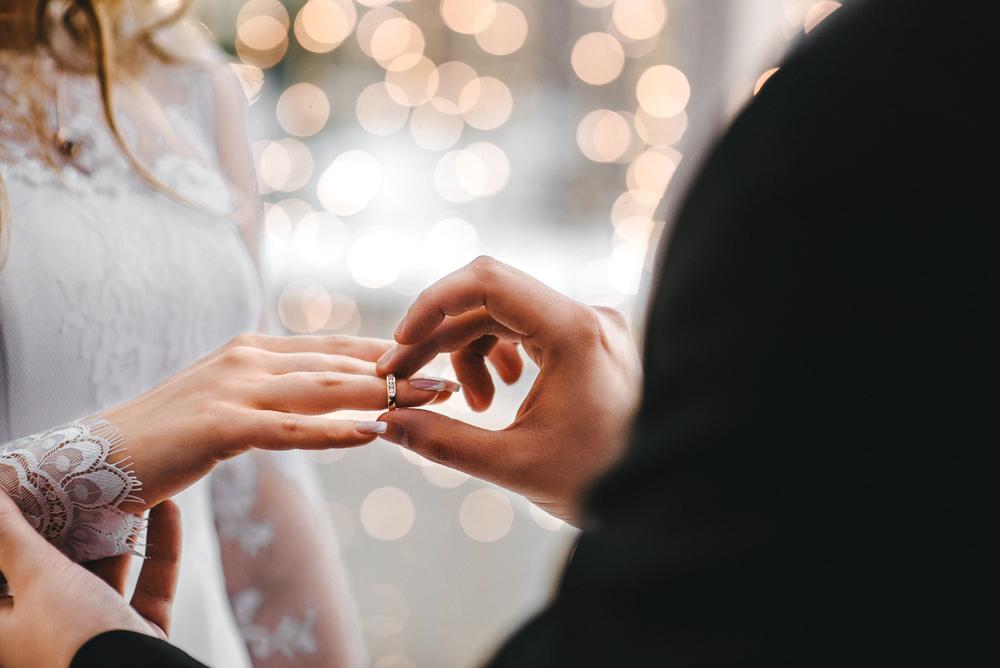 With the exchange of wedding rings, a couple seals their holy vows for eternity. (KirylV/Shutterstock)
