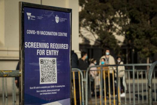 People are seen outside the Royal Exhibition Building Vaccination Centre in Carlton in Melbourne, Australia, on Aug. 25, 2021. (Darrian Traynor/Getty Images)