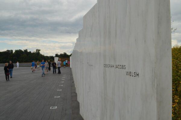 View down the Wall of Names as it follows the flight path to the Ceremonial Gate and the crash site beyond at the Flight 93 National Memorial. (Brendan Wilson/NPS)