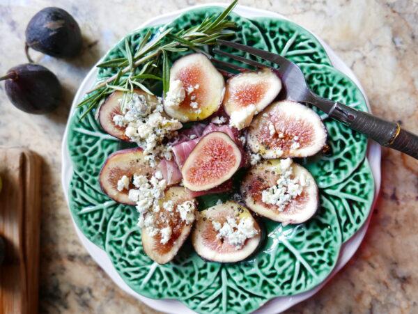 Sliced figs arranged with rolled up jamón and blue cheese crumbles make an elegant first course. (Victoria de la Maza)
