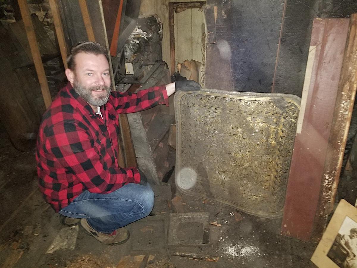 David shows off some of the antique items he found in his hidden attic. (Courtesy of <a href="https://www.whitcombfirm.com/">David Whitcomb</a>)