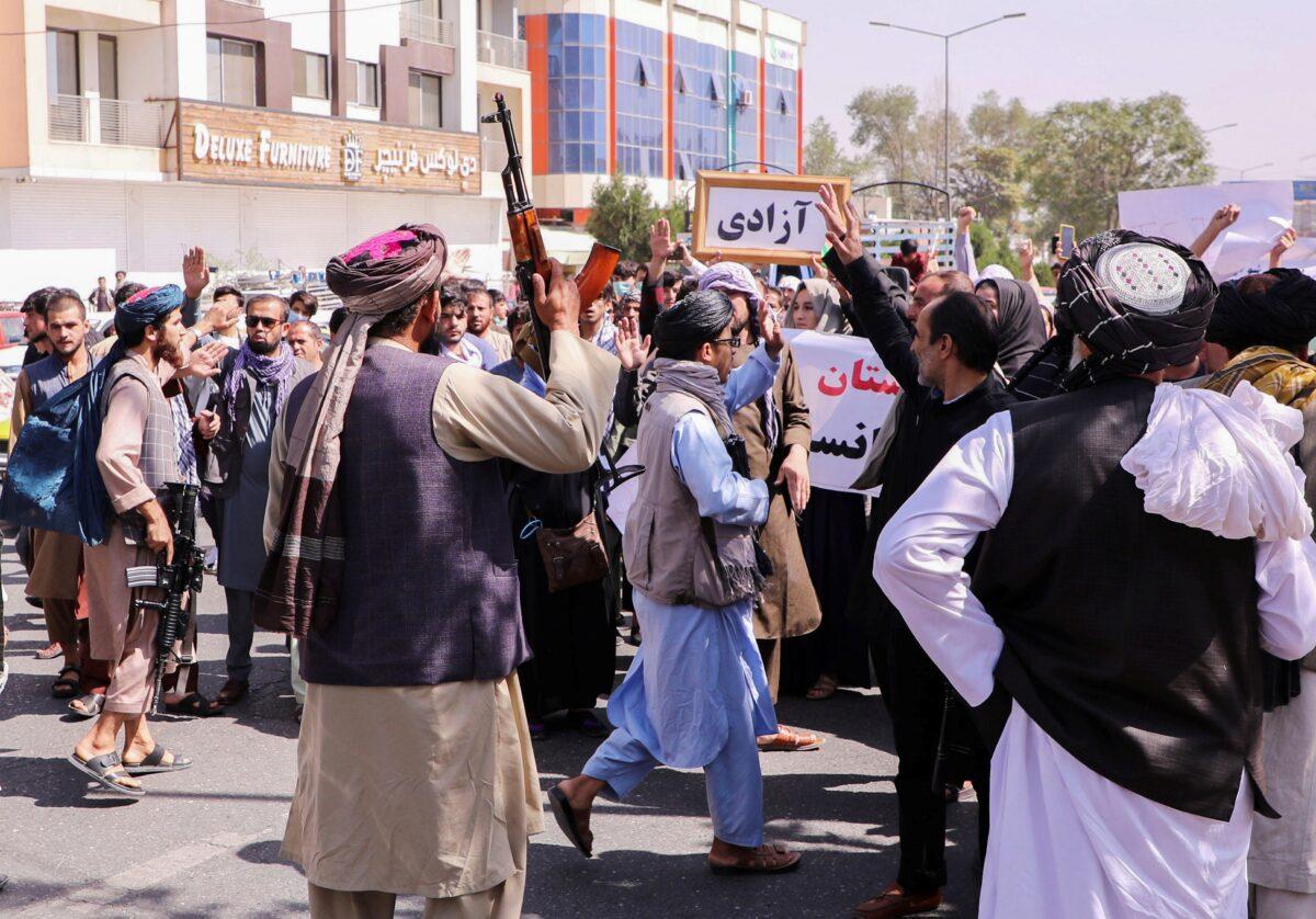 Taliban fighters try to stop the protesters, as they shout slogans during an anti-Pakistan protest, near the Pakistan Embassy in Kabul, Afghanistan, on Sept. 7, 2021. (Stringer/Reuters)