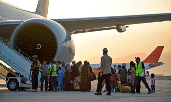Biden Administration to Resume Transport Flights After Vaccinating 49,000 Afghan Evacuees