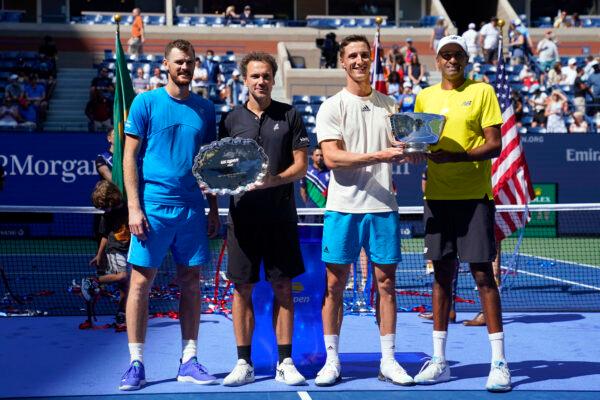 (From L) Runner-ups Jamie Murray of Great Britain and Bruno Soares of Brazil, and champions Joe Salisbury of Great Britain and Rajeev Ram of the United States pose with their trophies on day twelve of the 2021 U.S. Open tennis tournament at USTA Billie Jean King National Tennis Center in Flushing, New York, on Sept. 10, 2021. (Danielle Parhizkaran/USA TODAY Sports via Reuters)