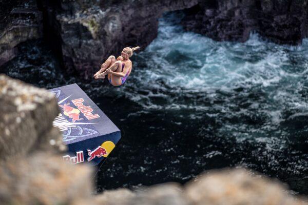 Rhiannan Iffland of Australia dives from the 21-meter platform during the final competition day of the fourth stop of the Red Bull Cliff Diving World Series at Downpatrick Head, Ireland, on Sept. 12, 2021. (Dean Treml/Red Bull Content Pool via Reuters)