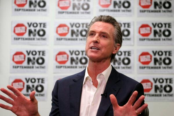 California Gov. Gavin Newsom is photographed during a TV interview before a rally against the California gubernatorial recall election on Sunday, Sept. 12, 2021, in Sun Valley, Calif. (AP Photo/Ringo H.W. Chiu)