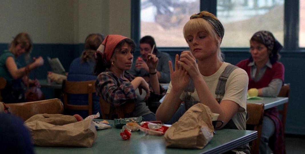 Lynette Pomeroy (Lisa Blount, front R) is a long-term paper factory employee, having a sandwich on her coffee break, in "An Officer and a Gentleman." (Lorimar Productions/Paramount Pictures)