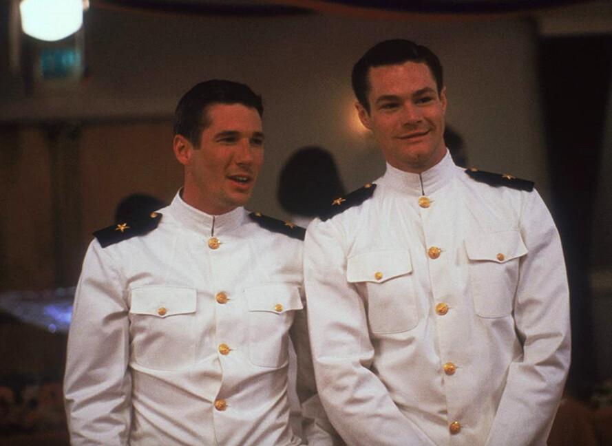 Zack Mayo (Richard Gere, L) and Sid Worley (David Keith) scope out the possibilities at the Navy Ball, in "An Officer and a Gentleman." (Lorimar Productions/Paramount Pictures)
