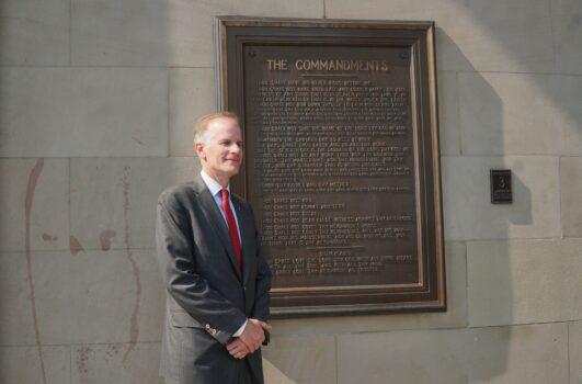 Bill McSwain beside the Ten Commandments plaque hanging on the Chester County Courthouse. He mentioned during his speech that he served as lead counsel in the Chester County, PA "Ten Commandments" case, in which he defeated several atheist groups who wanted to remove the plaque from the courthouse's façade in 2003. (Lily Sun/The Epoch Times)