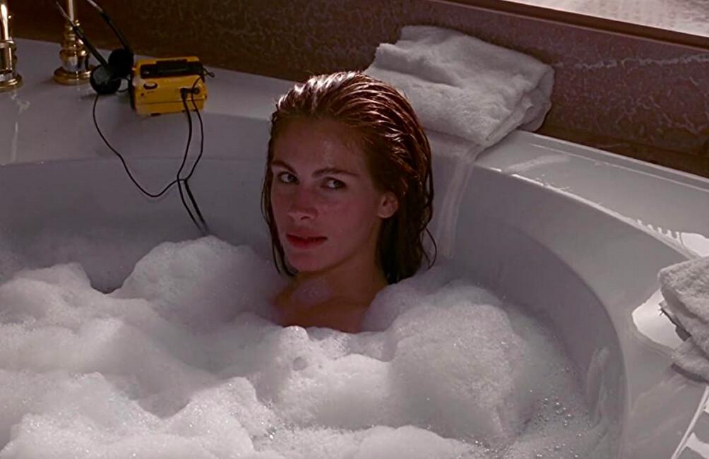 Vivian Ward (Julia Roberts), having been caught singing "Kiss" by Prince in the bathtub by Edward Lewis (Richard Gere), drives a not-as-hard-as-she-thinks-it-is bargain for taking a job as eye candy, among other things, in “Pretty Woman.” (Buena Vista Pictures/Touchstone Pictures)