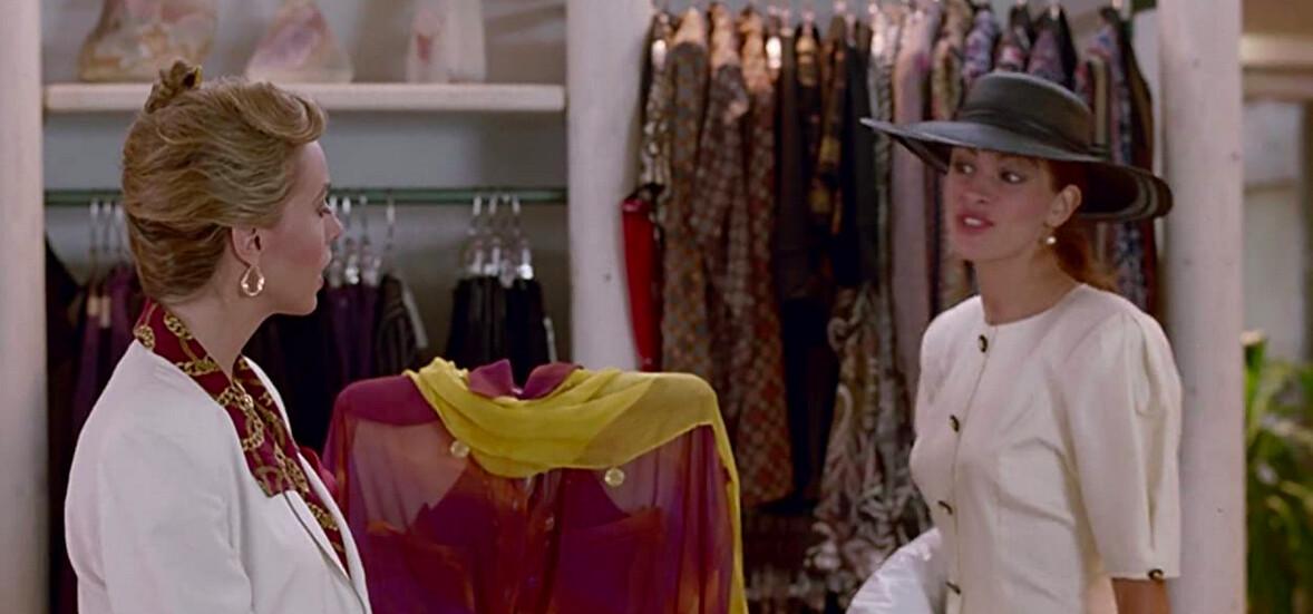 Vivian Ward (Julia Roberts, R) gives a hoity-toity saleswoman (Carol Williard) some extremely satisfying payback, in “Pretty Woman.” (Buena Vista Pictures/Touchstone Pictures)<em>      </em>