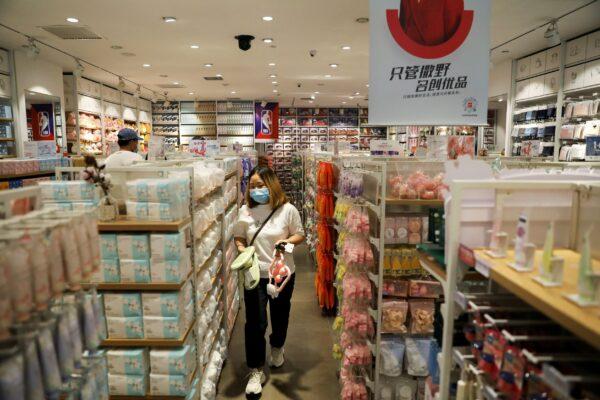 A customer shops at a store of Chinese retailer MINISO Group in Beijing, China on Sept. 13, 2021. (Tingshu Wang/Reuters)