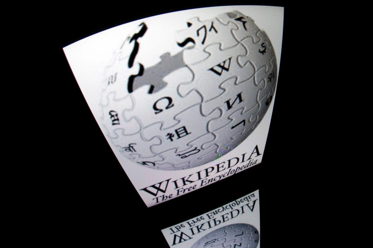 The "Wikipedia" logo is seen on a tablet screen in Paris on Dec. 4, 2012. Lionel Bonaventure/AFP via Getty Images)