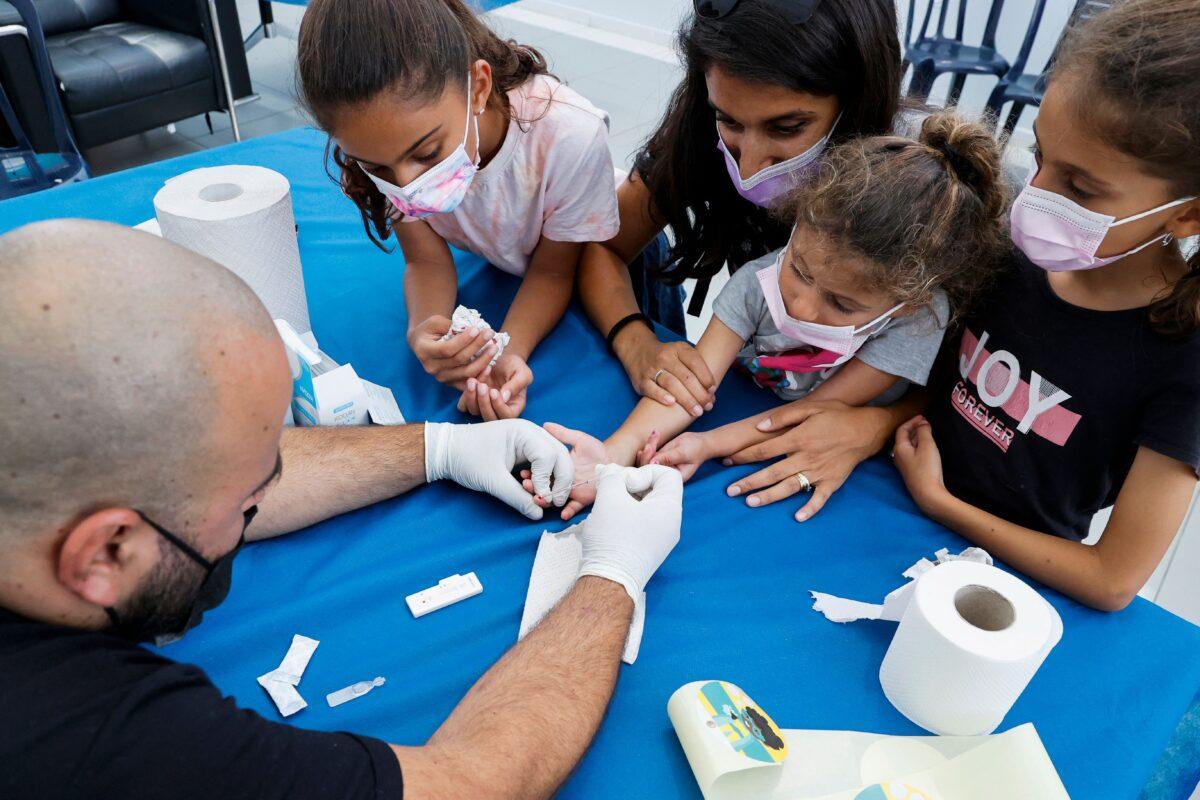 Israeli children undergo COVID-19 antibody testing in the coastal city of Netanya on Aug. 22, 2021. (Jack Guez/AFP via Getty Images)