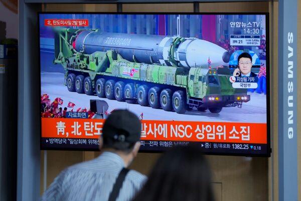 People watch a TV screen showing a news program reporting about North Korea's missiles with file footage in Seoul, South Korea, on Sept. 15, 2021. (Lee Jin-man/AP Photo)
