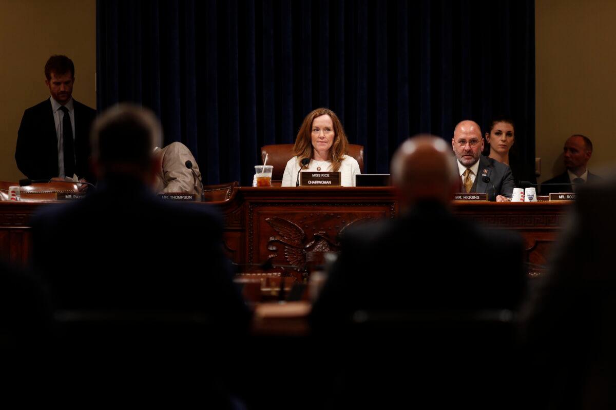 Rep. Kathleen Rice (D-N.Y.) is seen as Rep. Clay Higgins (R-La.) sits nearby during a hearing in Washington, on June 20, 2019. (Tom Brenner/Getty Images)
