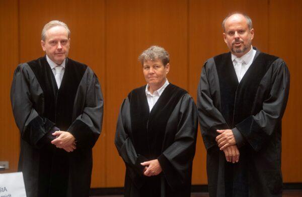 Prosecutors Andre Schmidt, Elke Hoppenworth and Daniel Facca attend the start of a trial against four former Volkswagen executives, charged with misconduct over their role in the carmaker's manipulation of diesel emissions testing, in Brunswick, Germany on Sept. 16, 2021. (Julian Stratenschulte/Pool via Reuters)