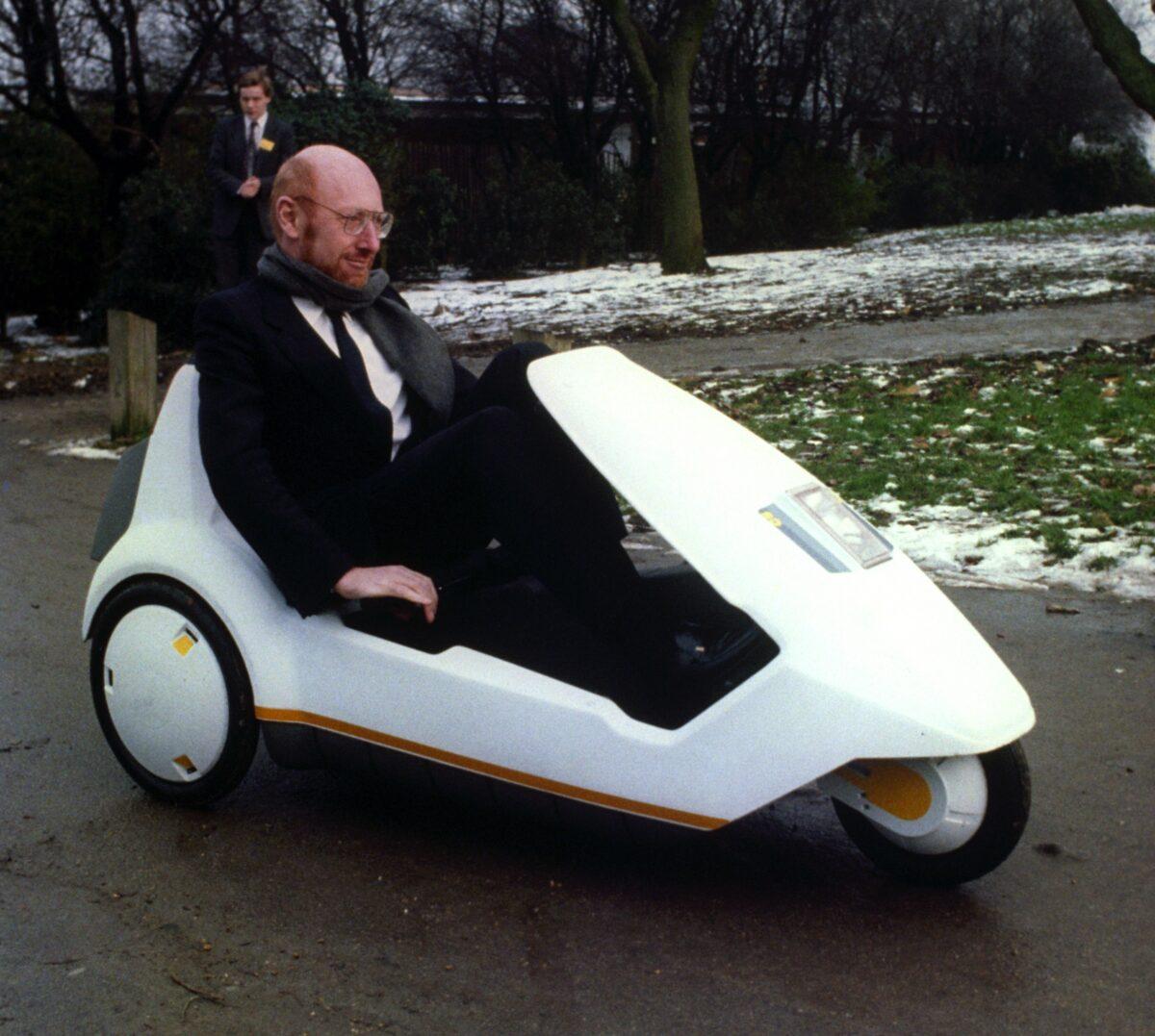 Sir Clive Sinclair demonstrating his C5 electric vehicle, the battery-come-pedal powered trike, at Alexandra Palace, in a file photo on Jan. 10, 1985. (PA Images