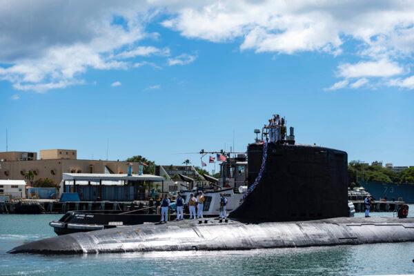 The Virginia-class fast-attack submarine USS Illinois (SSN 786) returns home to Joint Base Pearl Harbor-Hickam from a deployment in the 7th Fleet area of responsibility. Illinois performed a full spectrum of operations, including anti-submarine and anti-surface warfare, during the six-month, Indo-Pacific deployment. (U.S. Navy photo by Mass Communication Specialist 1st Class Michael B. Zingaro)