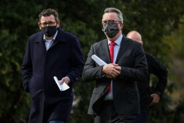 Victorian Premier Daniel Andrews, Health Minister Martin Foley and Victorian COVID-19 Testing Commander Jeroen Weimar arrive at the daily press conference on July 27, 2021 in Melbourne, Australia. (Darrian Traynor/Getty Images)