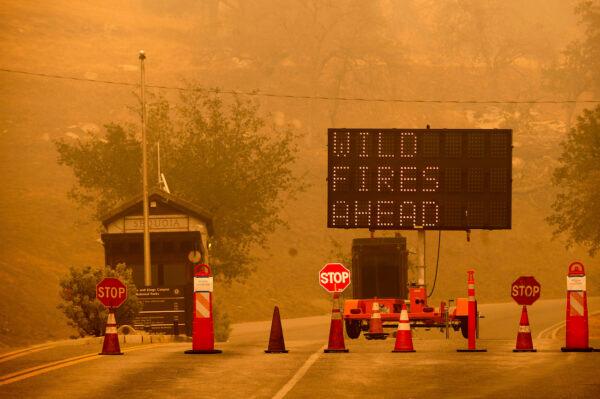 Cones block the entrance to Sequoia National Park, Calif., as the KNP Complex Fire burns nearby, on Sept. 15, 2021. (Noah Berger/AP Photo)