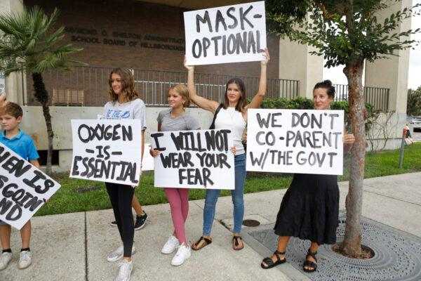 Families protest any potential mask mandates before the Hillsborough County Schools Board meeting held at the district office in Tampa, Fla., on July 27, 2021. (Octavio Jones/Getty Images)