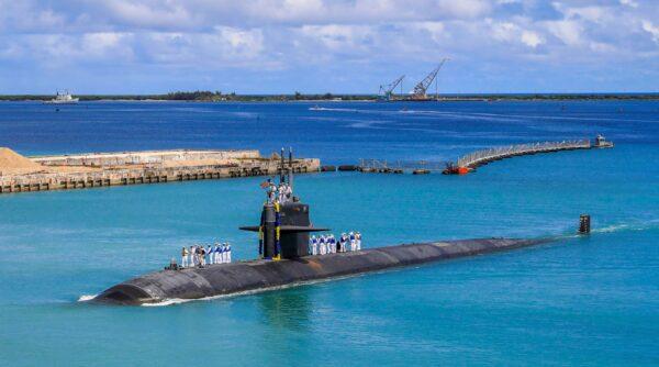 In this photo provided by U.S. Navy, the Los Angeles-class fast attack submarine USS Oklahoma City (SSN 723) returns to U.S. Naval Base in Guam on Aug. 19, 2021. (Mass Communication Specialist 3rd Class Naomi Johnson/U.S. Navy via AP)