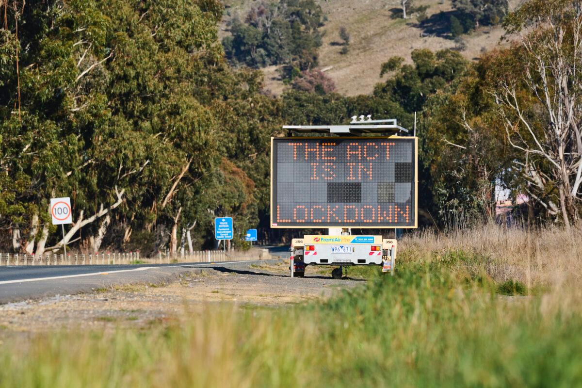 Signage on the ACT NSW border displaying lockdown information in Canberra, Australia, on Aug. 20, 2021. (Rohan Thomson/Getty Images)